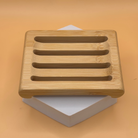 Natural bamboo soap dish from Ancient Health & Healings, featuring a sleek, eco-friendly design for organizing soap.