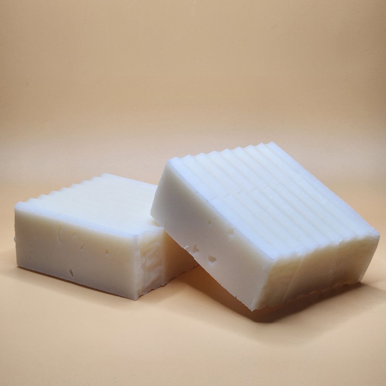 Ancient Health & Healings Tallow Shampoo Bar with summer citrus scent, natural shampoo for healthy hair, close-up of the bar.