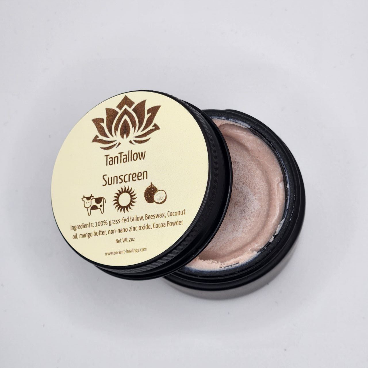 Ancient Health & Healings TanTallow Mineral Sunscreen in a 2oz bottle, natural tan-colored sunscreen for sun protection.