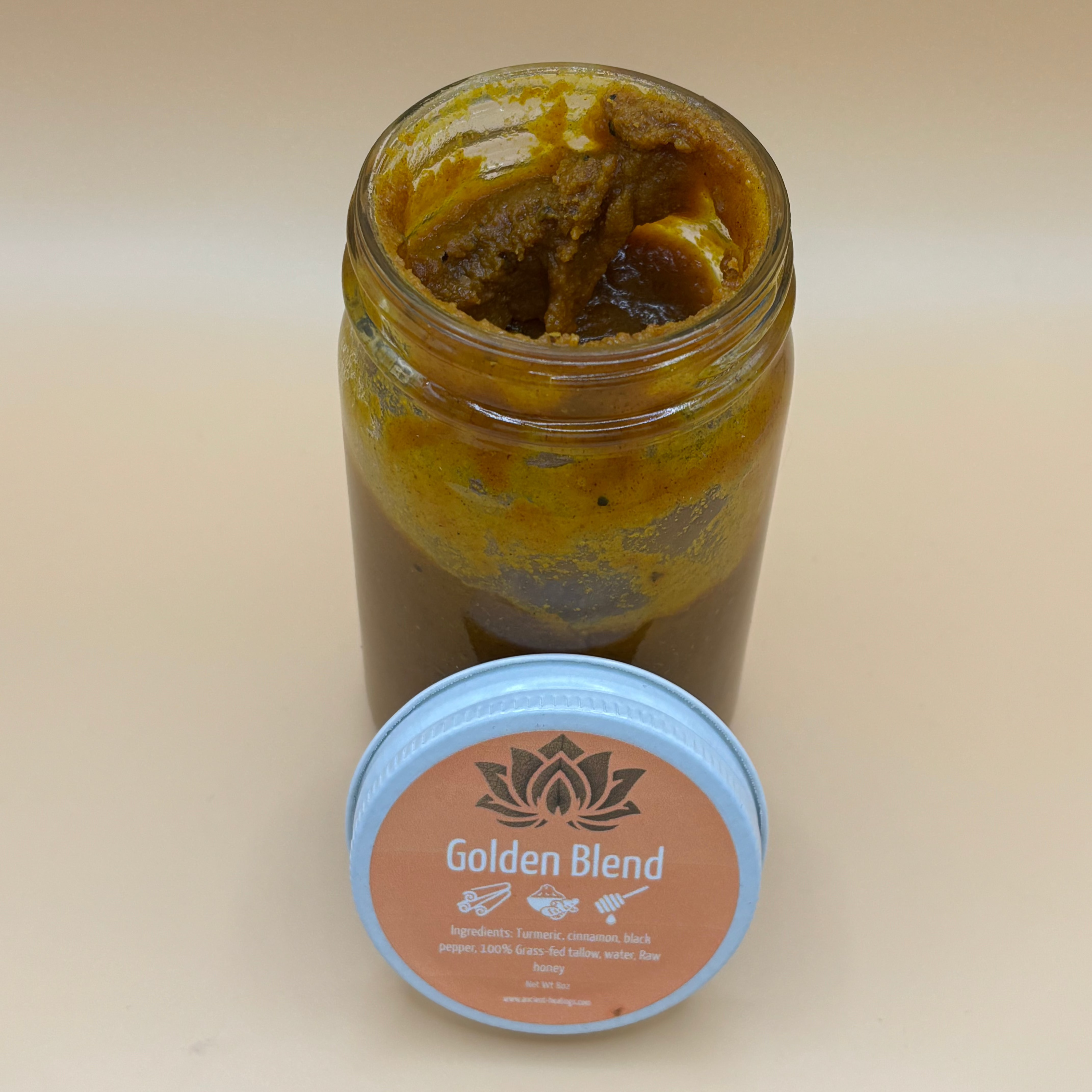 Golden Blend supplement by Ancient Health & Healings in a jar with a golden-colored powder inside.