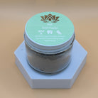 Ancient Health & Healings peppermint remineralizing tooth powder in a jar, showing the natural herbal ingredients and product packaging.