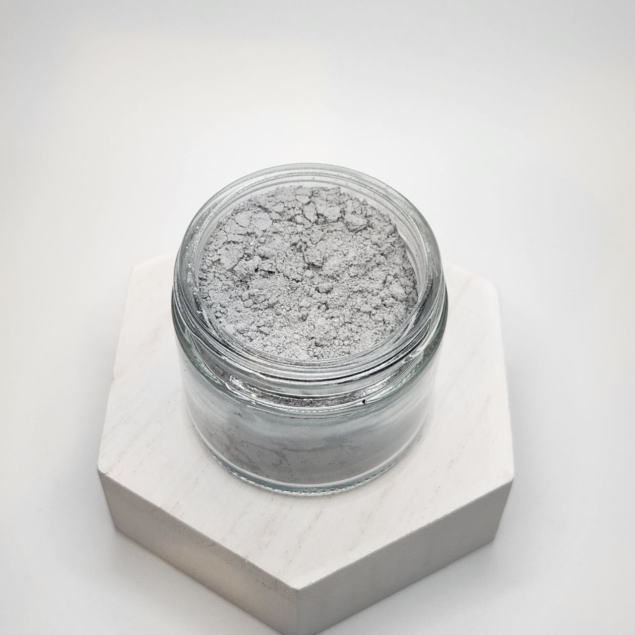 Ancient Health & Healings peppermint remineralizing tooth powder in a natural toothpaste form, showing the product packaging.