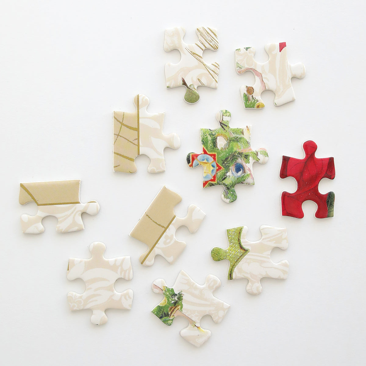 Christmas Botanicals jigsaw puzzle by Anna Griffin Inc. featuring festive botanical illustrations and colorful puzzle pieces.