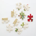 Christmas Botanicals jigsaw puzzle by Anna Griffin Inc. featuring festive botanical illustrations and colorful puzzle pieces.