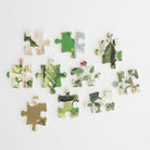 Christmas Post jigsaw puzzle by Anna Griffin Inc. featuring festive holiday postal scene with colorful vintage stamps and holiday decorations.