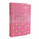 Pink notebook set with floral designs from Anna Griffin Inc., featuring multiple notebooks with decorative covers and binding.