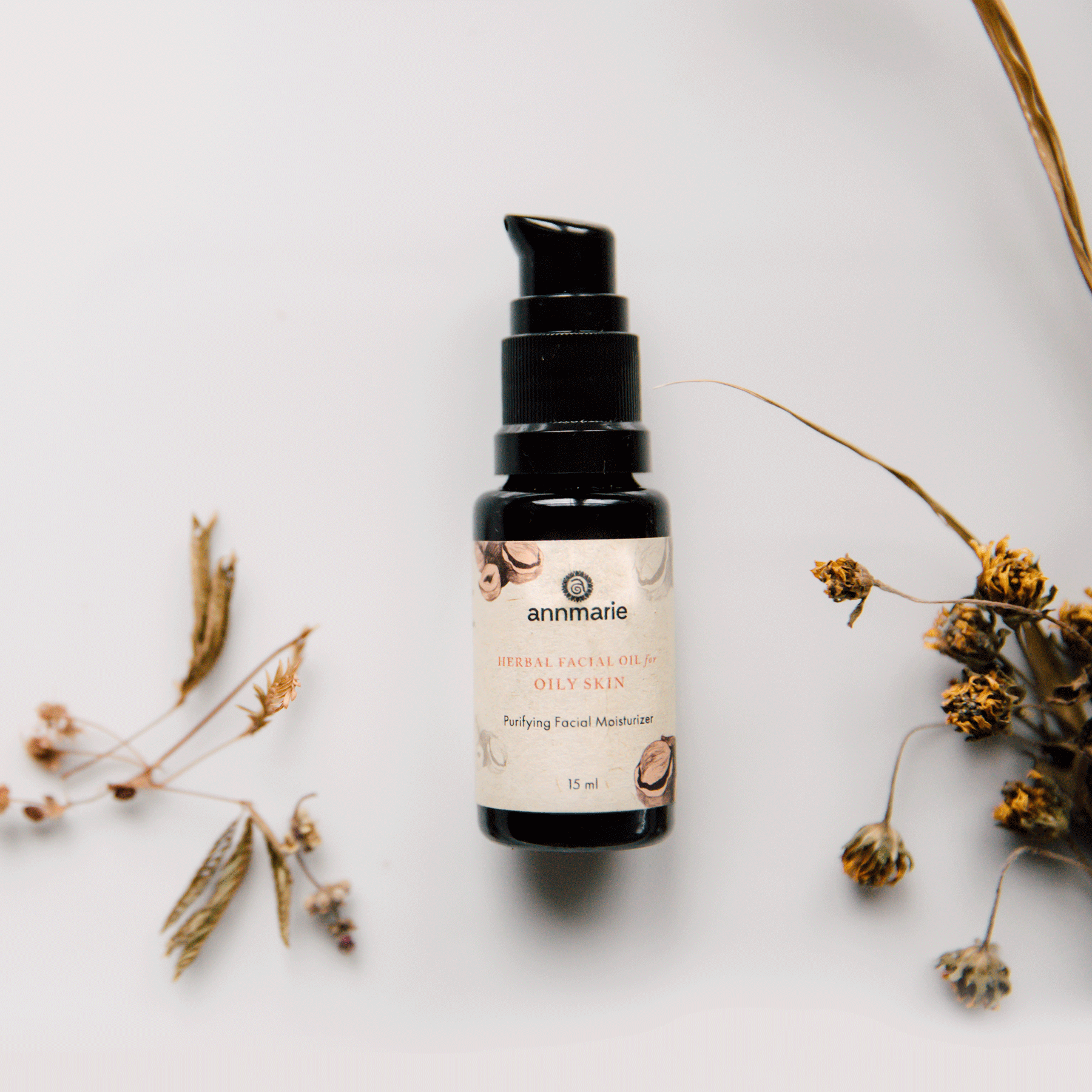 Herbal facial oil for oily skin by Annmarie Skin Care, 15ml bottle with natural herbal ingredients and dropper cap.