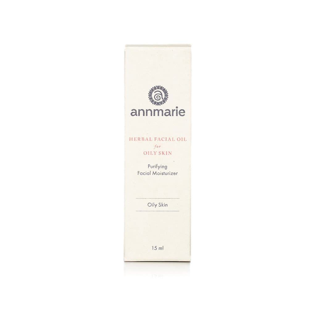 Bottle of Annmarie Skin Care herbal facial oil for oily skin, 15ml, featuring natural herbal ingredients in a clear glass bottle.