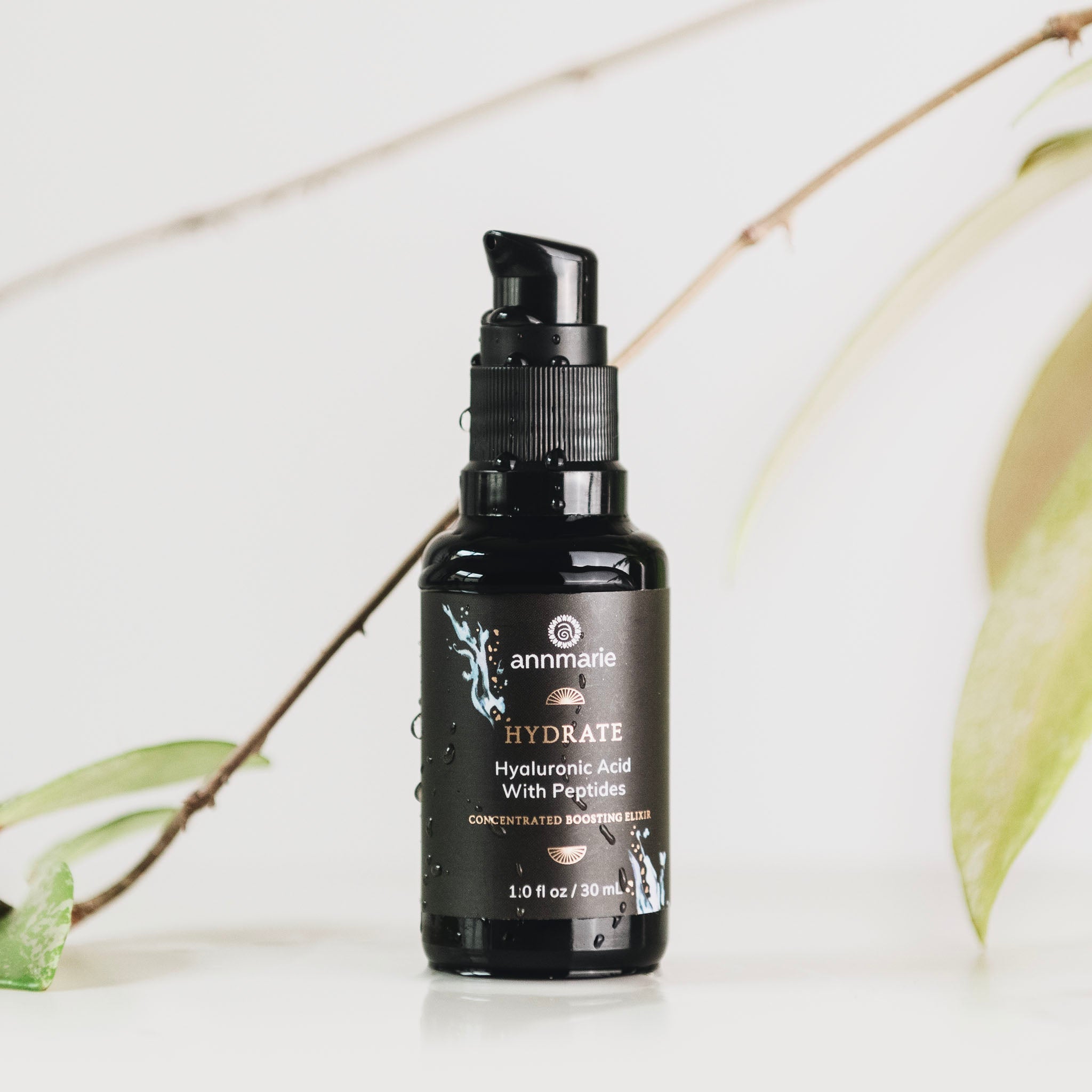 Bottle of Annmarie Skin Care Hydrate Hyaluronic Acid with Peptides serum in 30ml bottle with dropper cap.