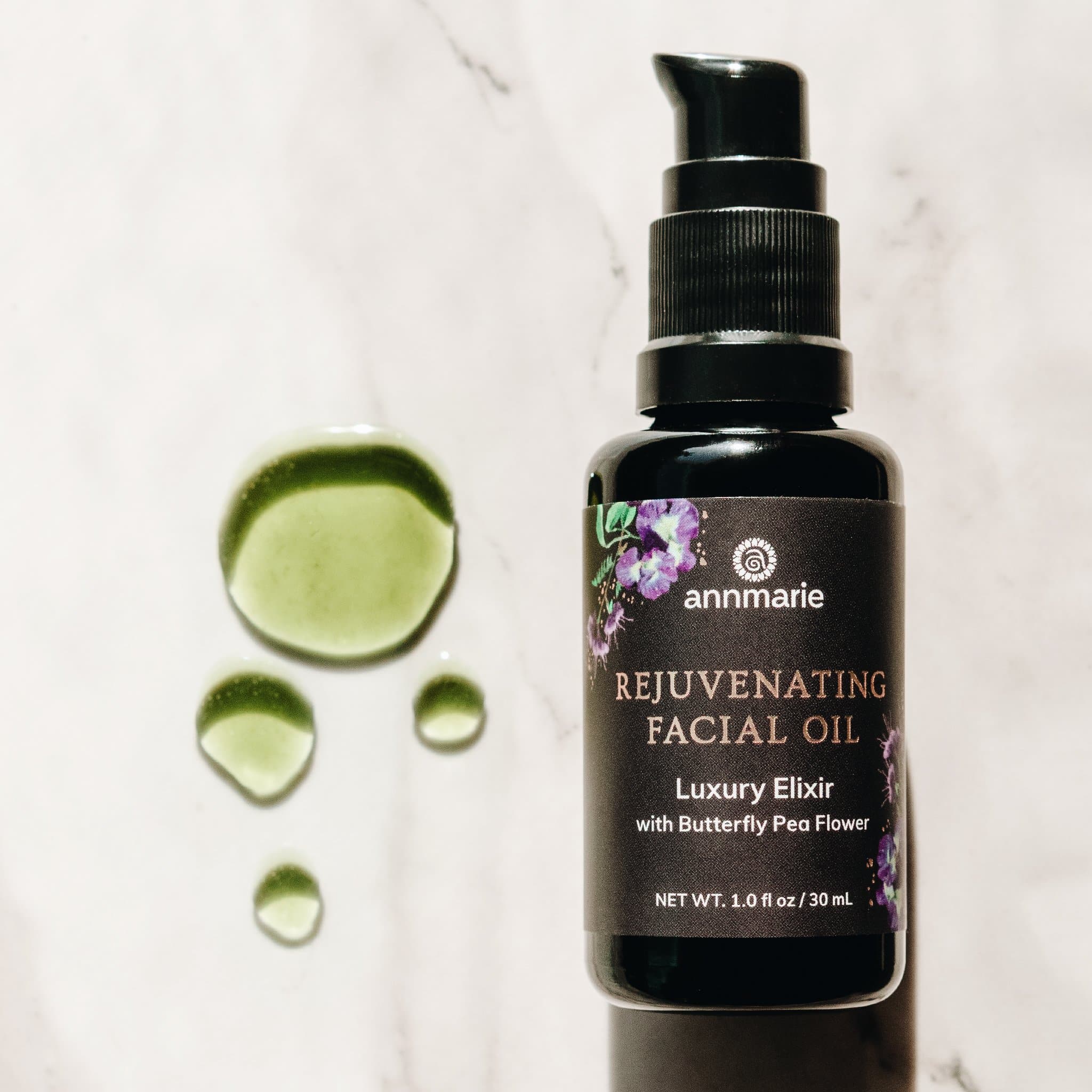 Bottle of Annmarie Skin Care Rejuvenating Facial Oil in a 30ml bottle, with natural ingredients and a sleek design.