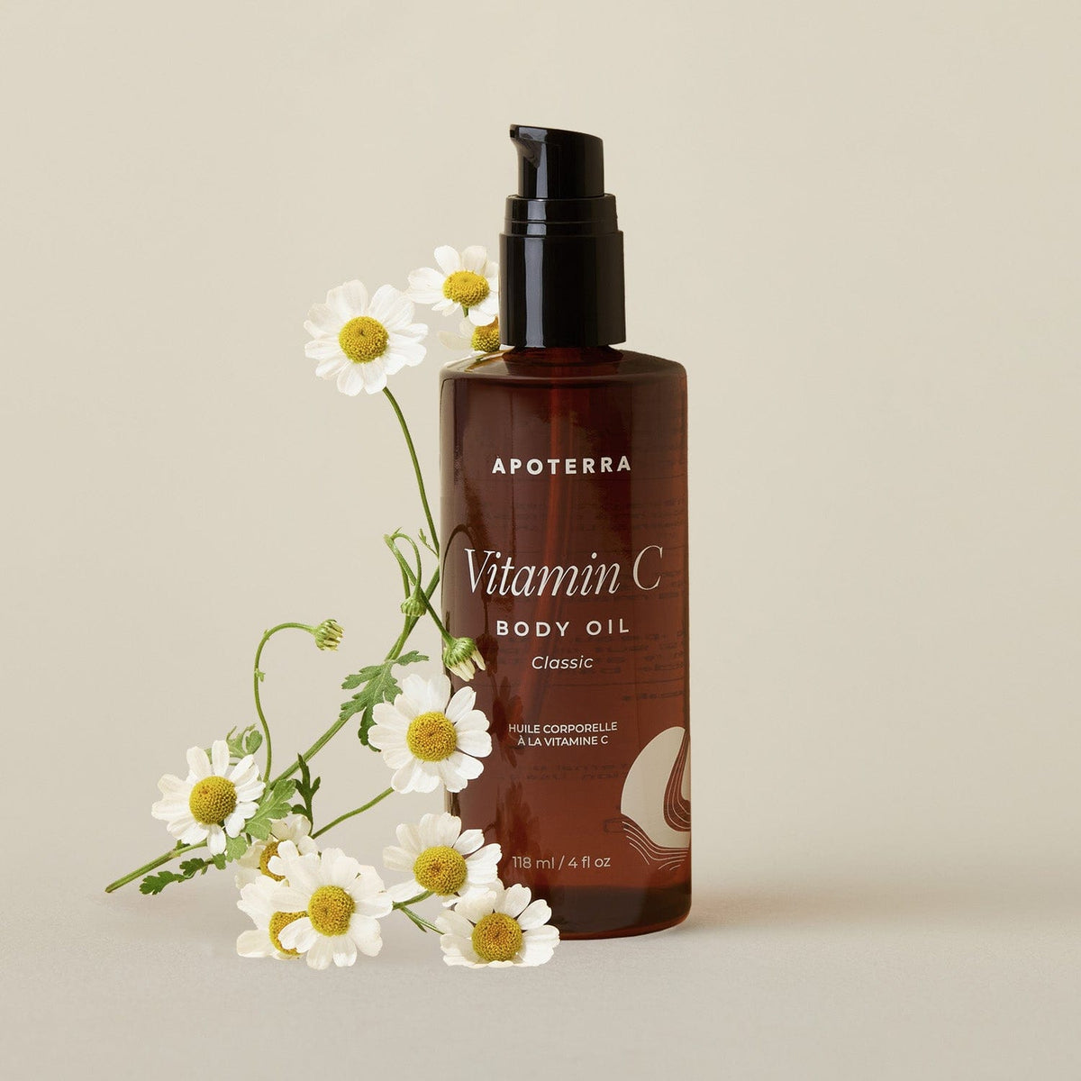 Bottle of Apoterra Vitamin C Body Oil for bath and body, unscented, with a clear label and natural ingredients visible.