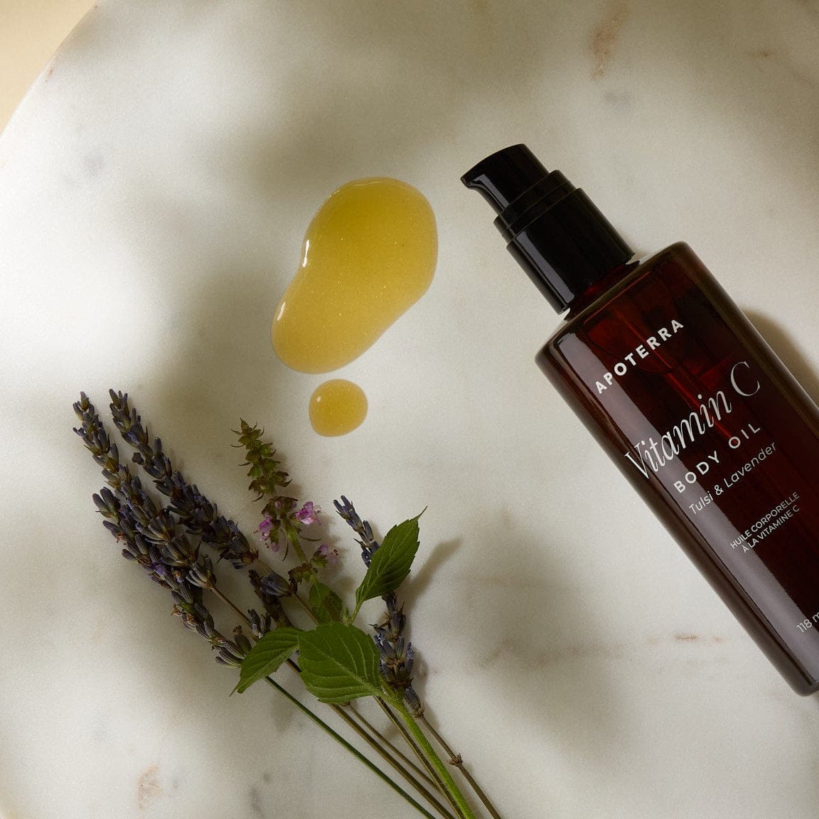 Apoterra Vitamin C Body Oil with lavender and tulsi, hydrating bath and body oil for radiant skin.