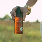 Apoterra Vitamin C Body Oil bottle and skincare setup for bath and body use in a natural lifestyle scene.
