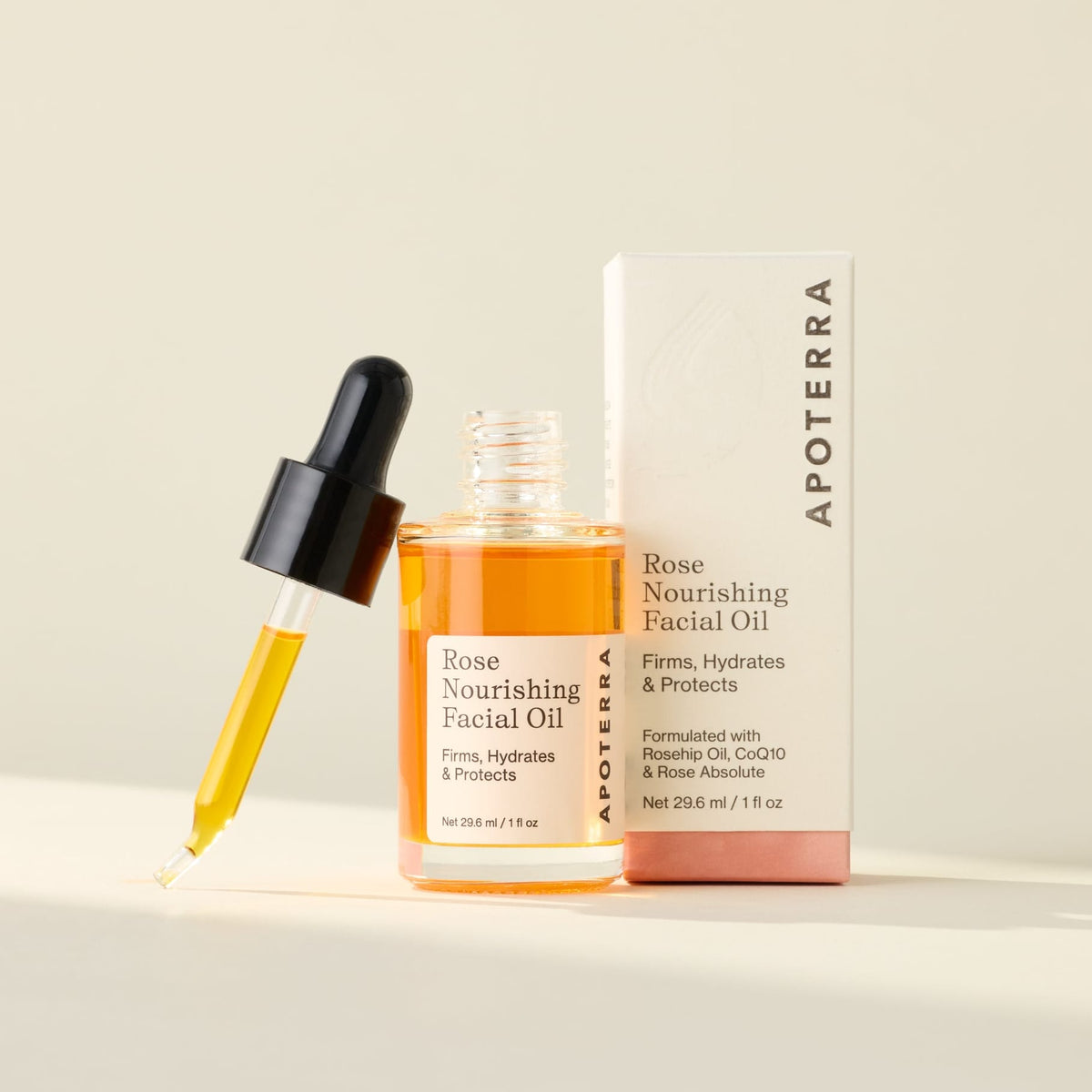 Apoterra Rose Nourishing Facial Oil bottle with rose petals, showcasing natural skincare for glowing, hydrated skin.