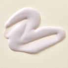 Apoterra Chamomile & Tansy Hydrating Cream Cleanser soap with creamy texture and herbal chamomile and tansy ingredients.