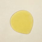 Apoterra Vetiver Illuminating Oil Cleanser soap with textured surface, showing a natural, earthy appearance and rich vetiver scent.