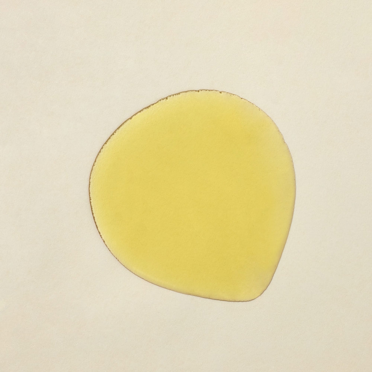 Apoterra Vetiver Illuminating Oil Cleanser soap with textured surface, showing a natural, earthy appearance and rich vetiver scent.