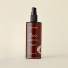 Apoterra Rose Essential Hydration Mist toner with a spray bottle, featuring rose extract for refreshing skin hydration.