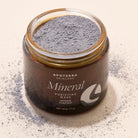 Apoterra mineral purifying mask treatment with charcoal and natural clay, showing its rich, textured mask for deep skin cleansing.