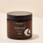 Apoterra Mineral Purifying Mask in a jar, showing the treatment product with natural mineral ingredients and a clean, skincare-ready look.
