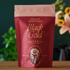 August Uncommon Tea Essentials Black Gold Black Tea in a 15-cup bag, featuring rich black tea leaves with gold accents.