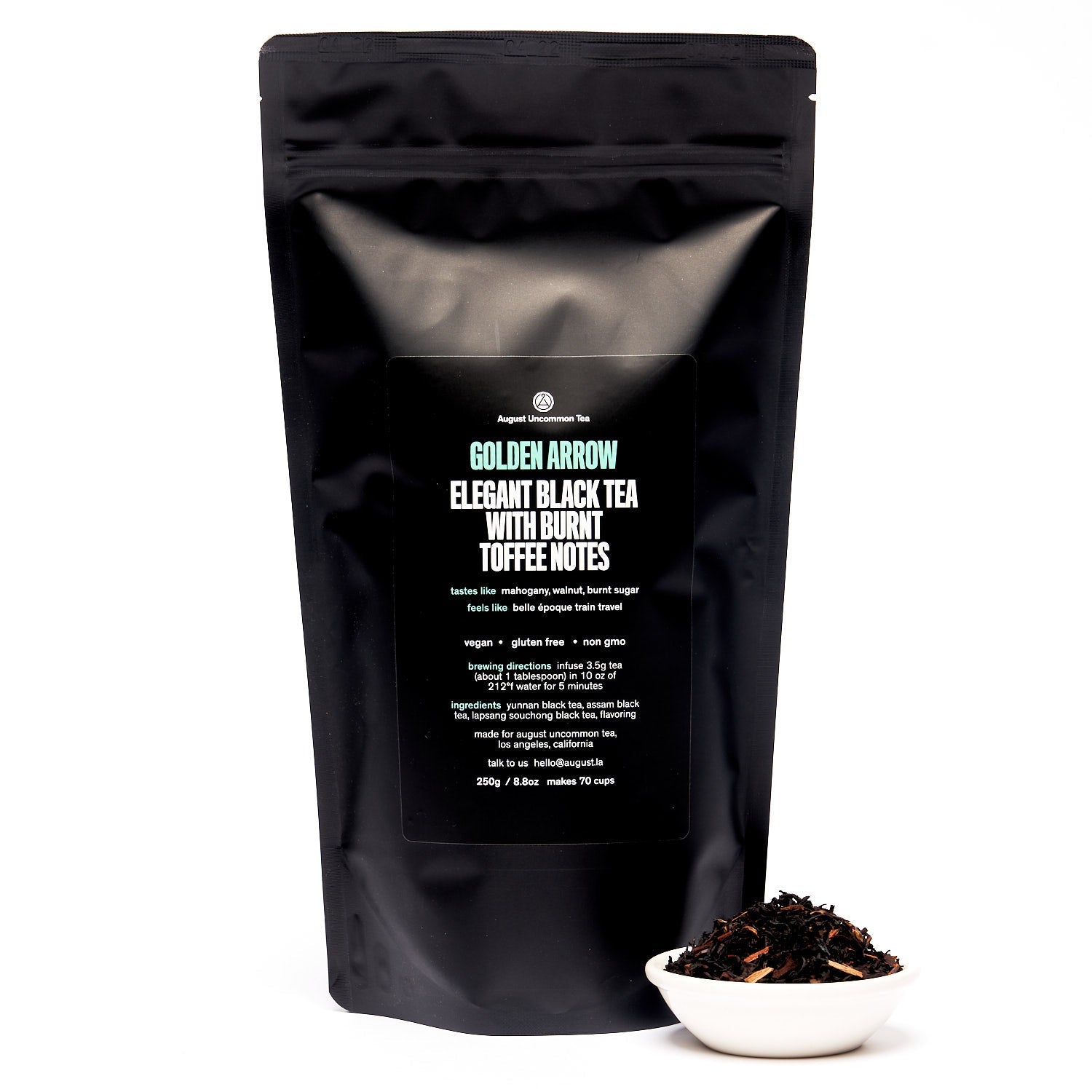 Golden Arrow Smoky Toffee Black Tea bag from August Uncommon Tea, showing the packaging with black and gold design.