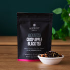 August Uncommon Tea Mackintosh Crisp Apple Black Tea in a 15-cup bag, showcasing fresh apple flavor and black tea leaves.