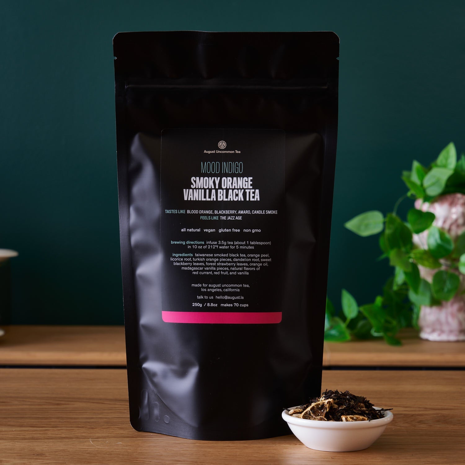 Smoky orange vanilla black tea in a 15-cup bag from August Uncommon Tea, showcasing the rich tea leaves and packaging.