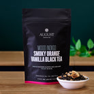 Black tea bag of Mood Indigo Smoky Orange Vanilla Black Tea by August Uncommon Tea, featuring an orange vanilla aroma.
