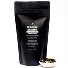Black Lodge Smoky Banana Black Tea by August Uncommon Tea in a 15-cup bag, showcasing the tea leaves and packaging.