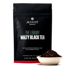 August Uncommon Tea Library Malty Black Tea bag, showcasing the black tea packaging with branding and product details.