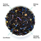 Black metallic tin of August Uncommon Tea Violet Elderberry Black Tea, a black tea beverage in a sleek, violet-colored container.