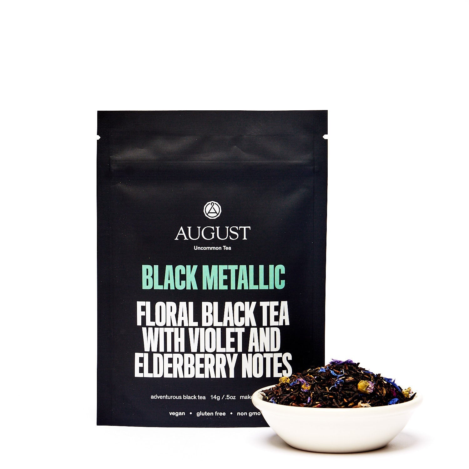 Black Metallic Violet Elderberry Black Tea tin from August Uncommon Tea, showcasing the elegant packaging of this black tea.