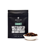 Black tea in a 28-cup tin labeled Cabaret Cherry Chocolate Black Tea by August Uncommon Tea, featuring a dark, aromatic tea blend.