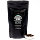 Cabaret Cherry Chocolate Black Tea by August Uncommon Tea in a 28-cup black tin, showcasing rich cherry and chocolate flavors.