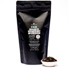 Jet Black Roasty Coffee Black Tea in a 28-cup tin by August Uncommon Tea, showcasing the rich black tea leaves inside.