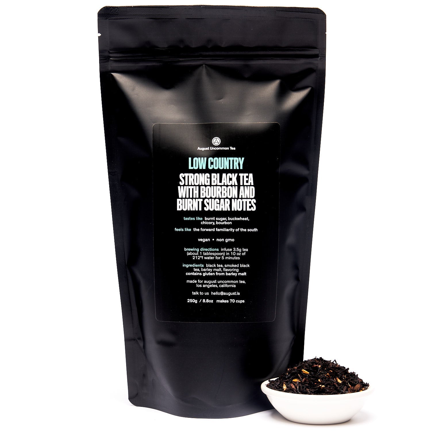 Black tea in a 28-cup tin from August Uncommon's Low Country Bourbon Sugar Black Tea collection, featuring rich brewed tea and tea leaves.