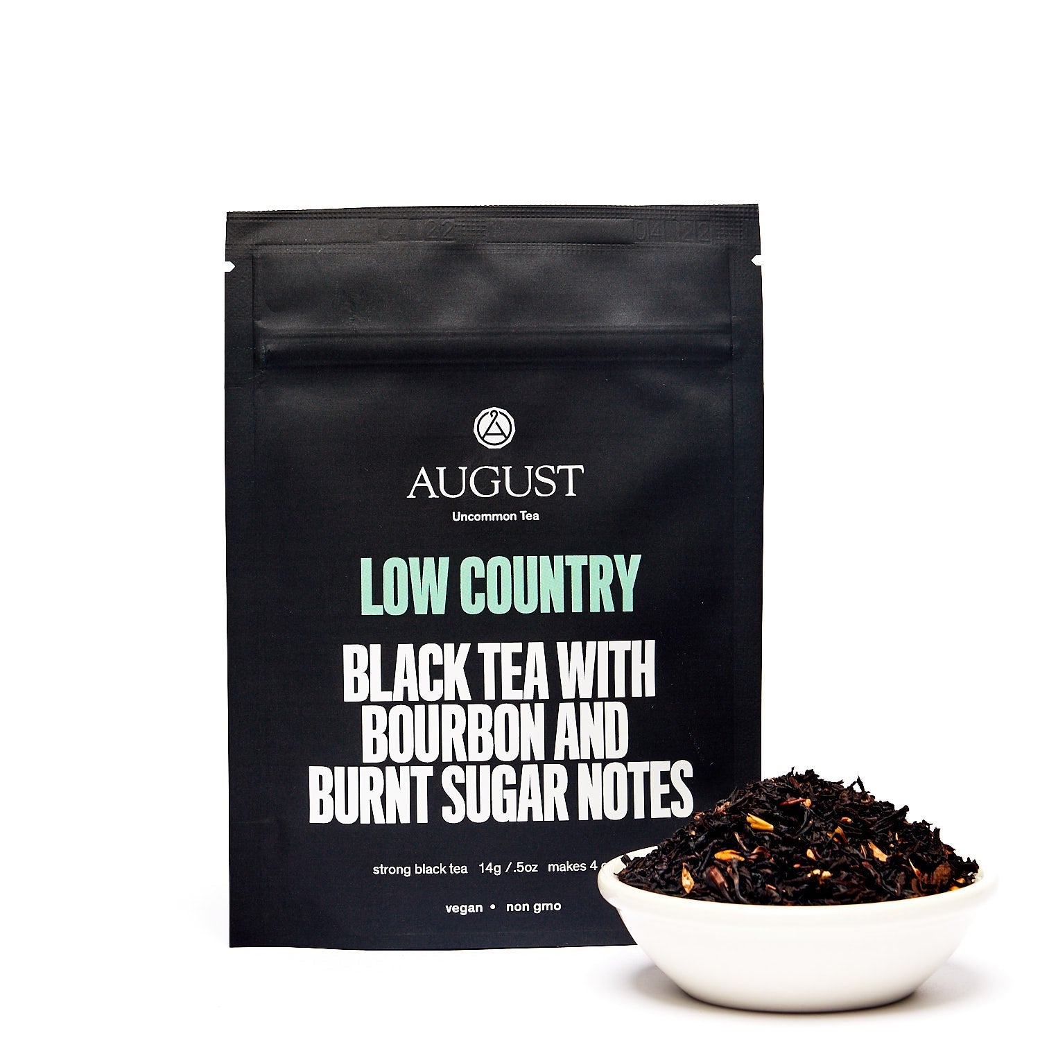 Black tea in a 28-cup tin, Low Country Bourbon Sugar Black Tea by August Uncommon Tea, with tea leaves and packaging visible.