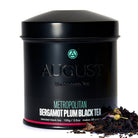 August Uncommon Tea Metropolitan Bergamot Plum Earl Grey Black Tea in a 28-cup tin, showcasing the black tea blend with bergamot and plum flavors.