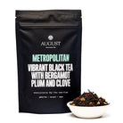August Uncommon Tea Metropolitan Bergamot Plum Earl Grey Black Tea in a 28-cup tin, featuring black tea with bergamot and plum flavors.