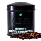 August Uncommon Tea Painted Desert Chocolate Chili Black Tea in a 28-cup tin, showcasing the dark, flavorful black tea blend.