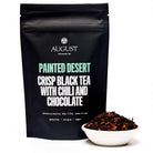 Black tea in a 28-cup tin, Painted Desert Chocolate Chili Black Tea by August Uncommon Tea, with a dark, rich appearance.