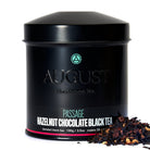 August Uncommon Tea Passage Hazelnut Chocolate Black Tea in a 28-cup tin, showcasing the black tea blend with hazelnut and chocolate notes.