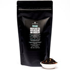 Black tea in a 28-cup tin from August Uncommon, Passage Hazelnut Chocolate Black Tea, showcasing the tea leaves and packaging.
