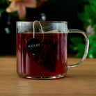 Jet Black Roasty Coffee Black Tea by August Uncommon Tea, 15 tea bags, packaged in a box with black and brown branding.