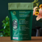 Bright green August Uncommon Tea Essentials Bright Green Green Tea in a 15-cup bag, showcasing fresh green tea leaves and packaging.