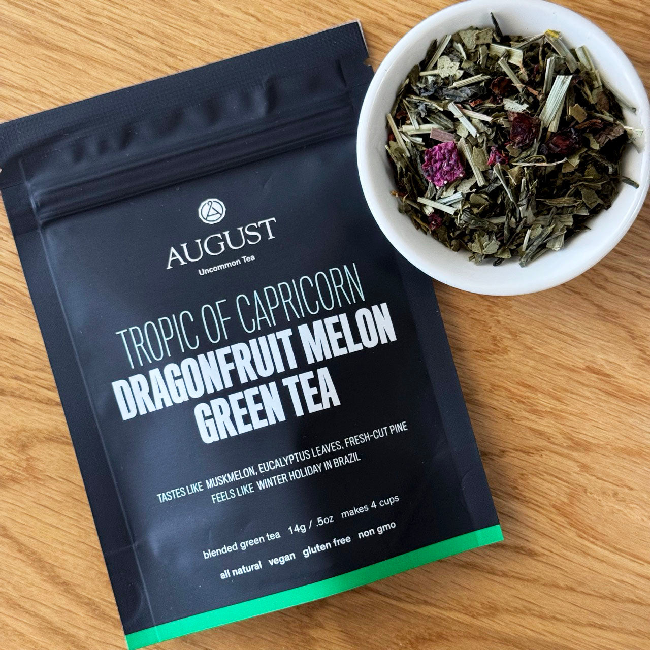 August Uncommon Tea Tropic of Capricorn Dragonfruit Melon Green Tea in a 15-cup bag, vibrant green tea with dragonfruit and melon flavors.
