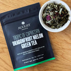 August Uncommon Tea Tropic of Capricorn Dragonfruit Melon Green Tea in a 15-cup bag, vibrant green tea with dragonfruit and melon flavors.