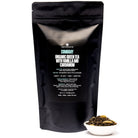 August Uncommon Tea Combray Vanilla Cardamom Green Tea in a 23-cup tin, showcasing fresh green tea leaves with vanilla and cardamom flavoring.