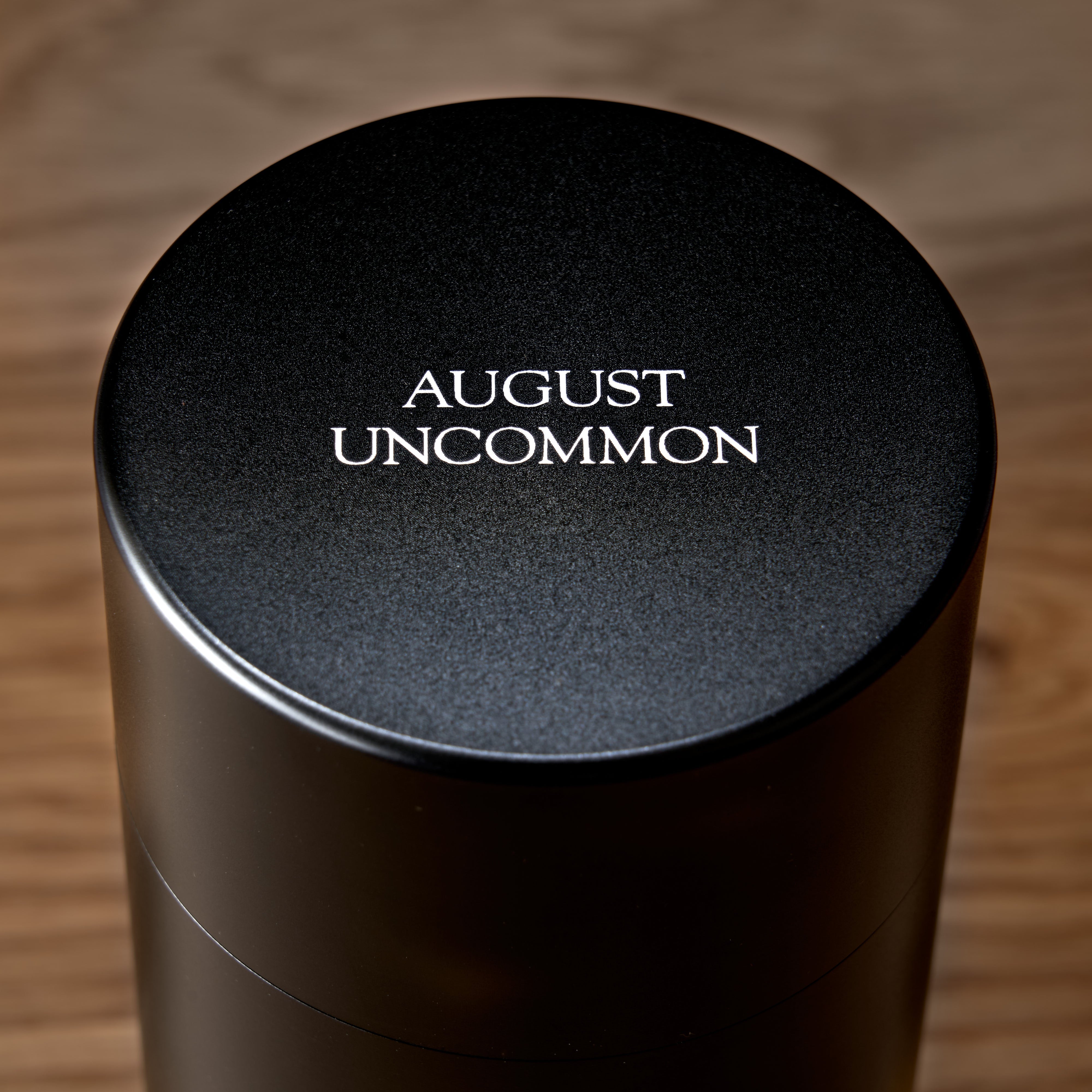 Single tin of Rare Leaves Emerald Pi Lo Chun Green Tea by August Uncommon Tea, showcasing fresh green tea leaves inside.